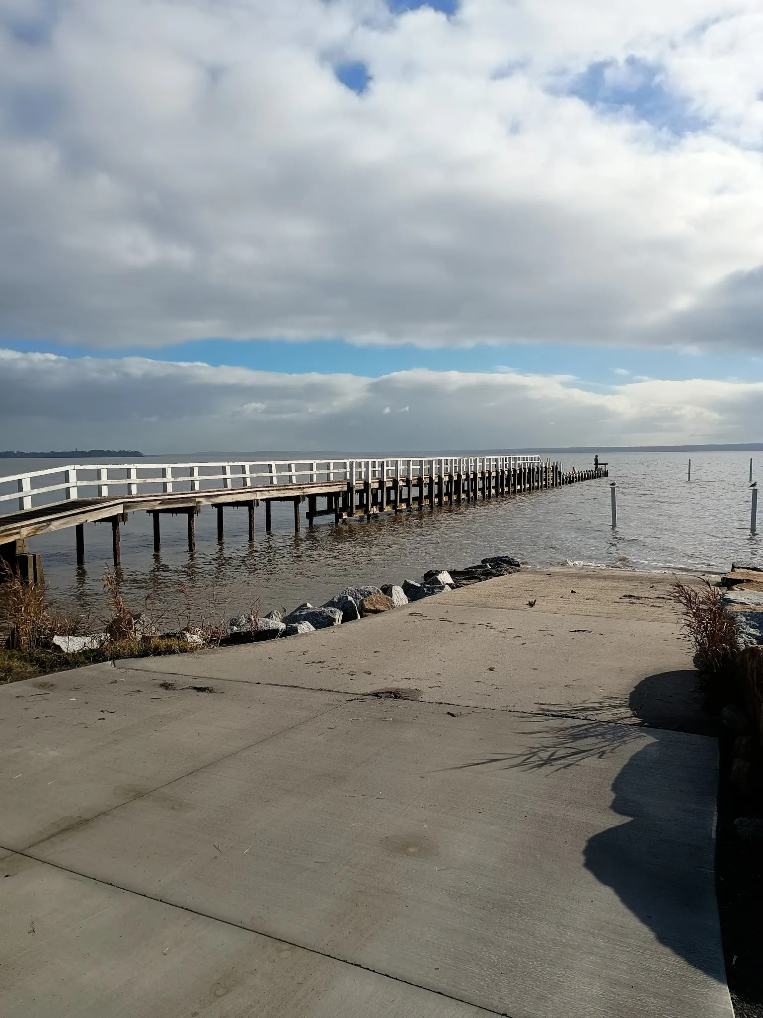White timber jetty reaching into Western Port Bay at Grantville