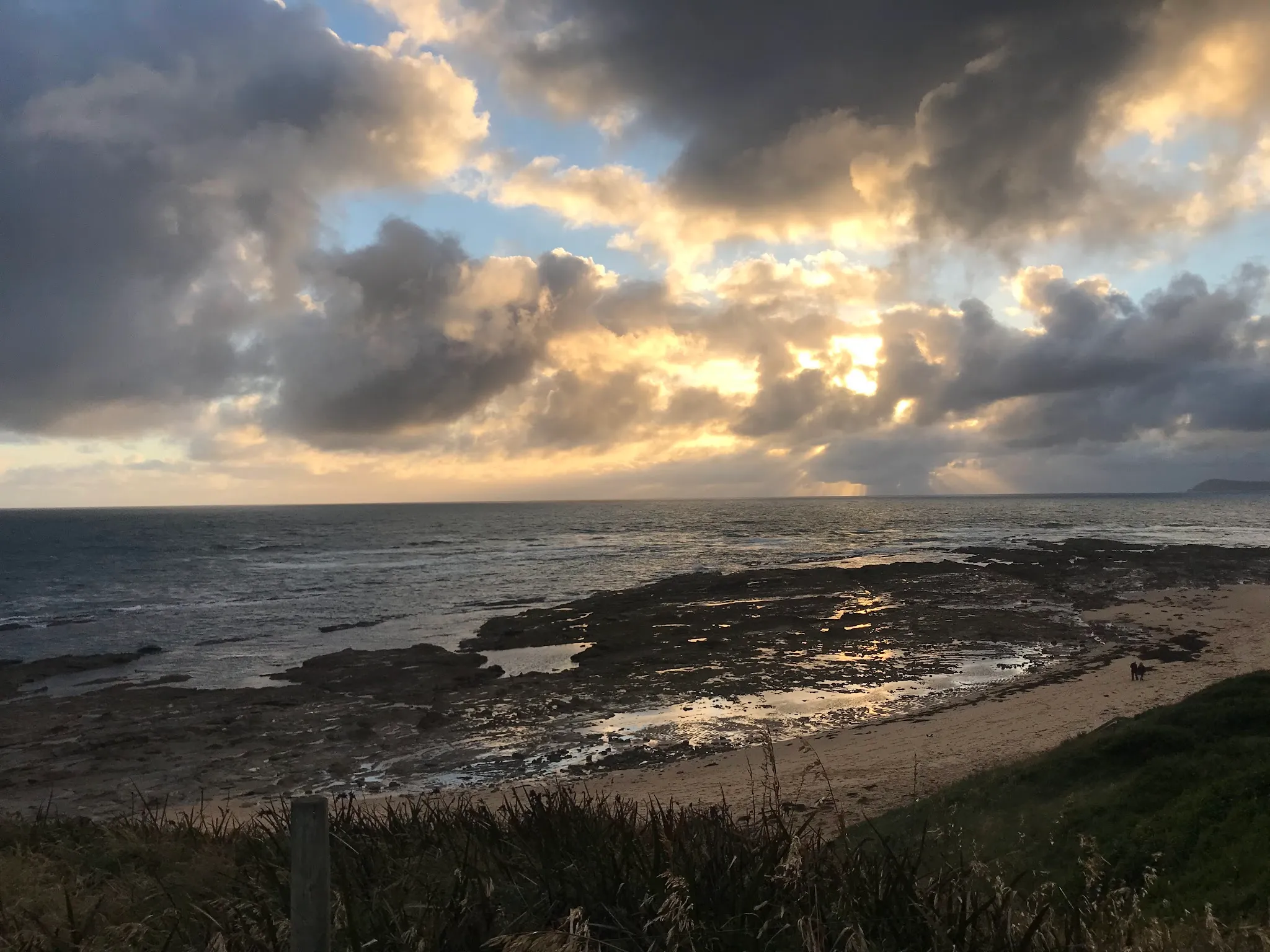 Golden sunset light over the rocky coastline near Grantville